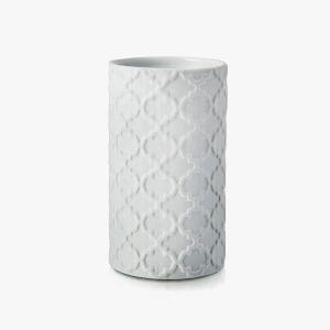 Modern white ceramic vase with intricate geometric pattern for home decor. Modern white ceramic vase with intricate geometric pattern for home decor.