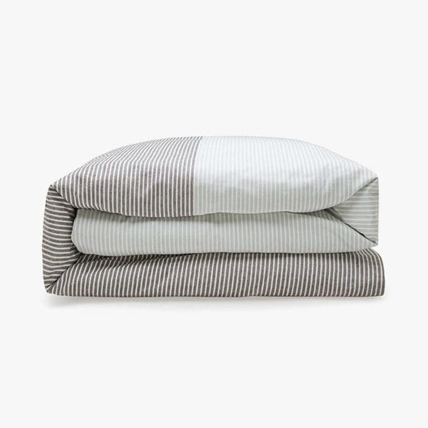 Comfortable striped bedding set for a cozy bedroom.